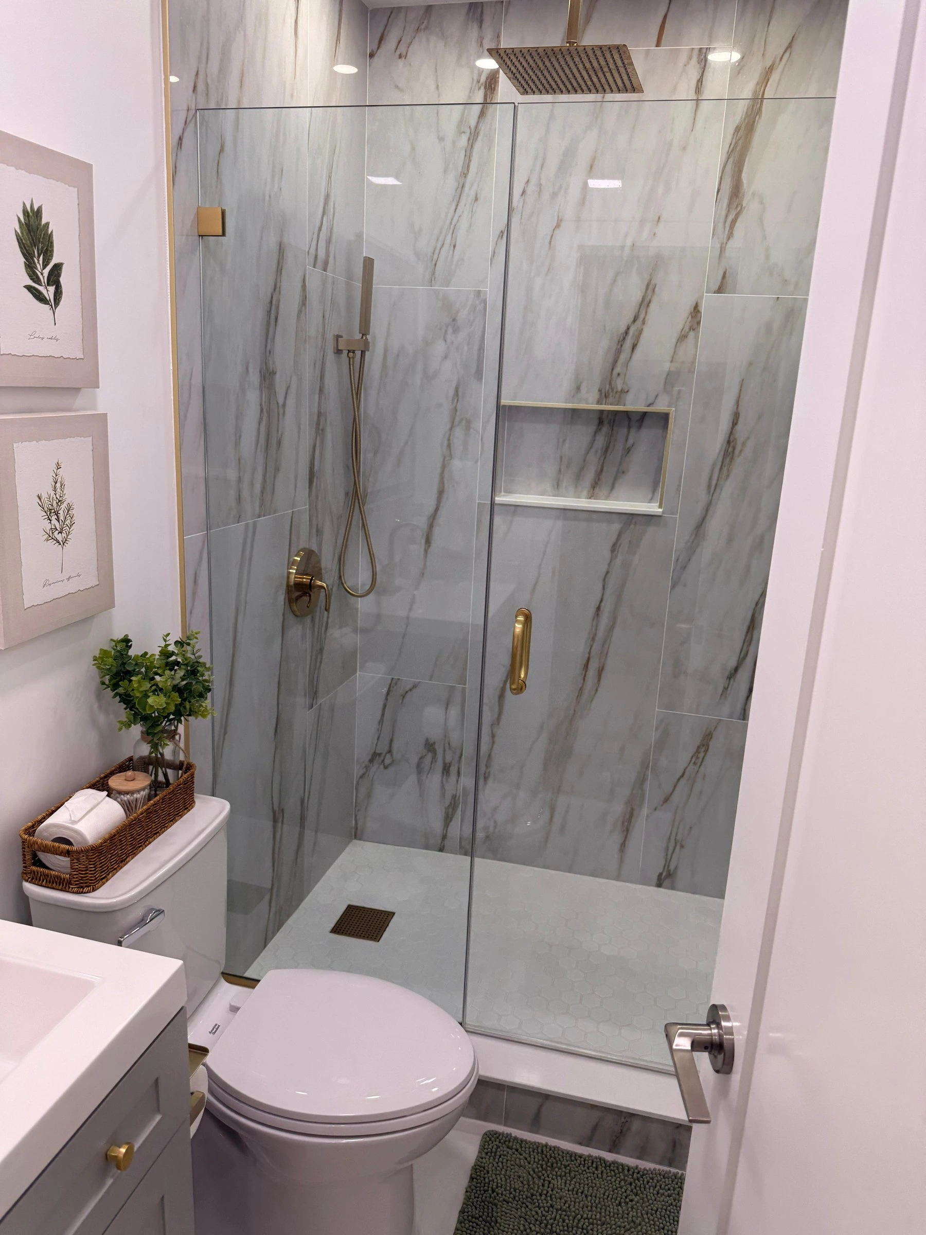 Glass walk-in shower and bathroom cleaned by AMH during an Airbnb turnover